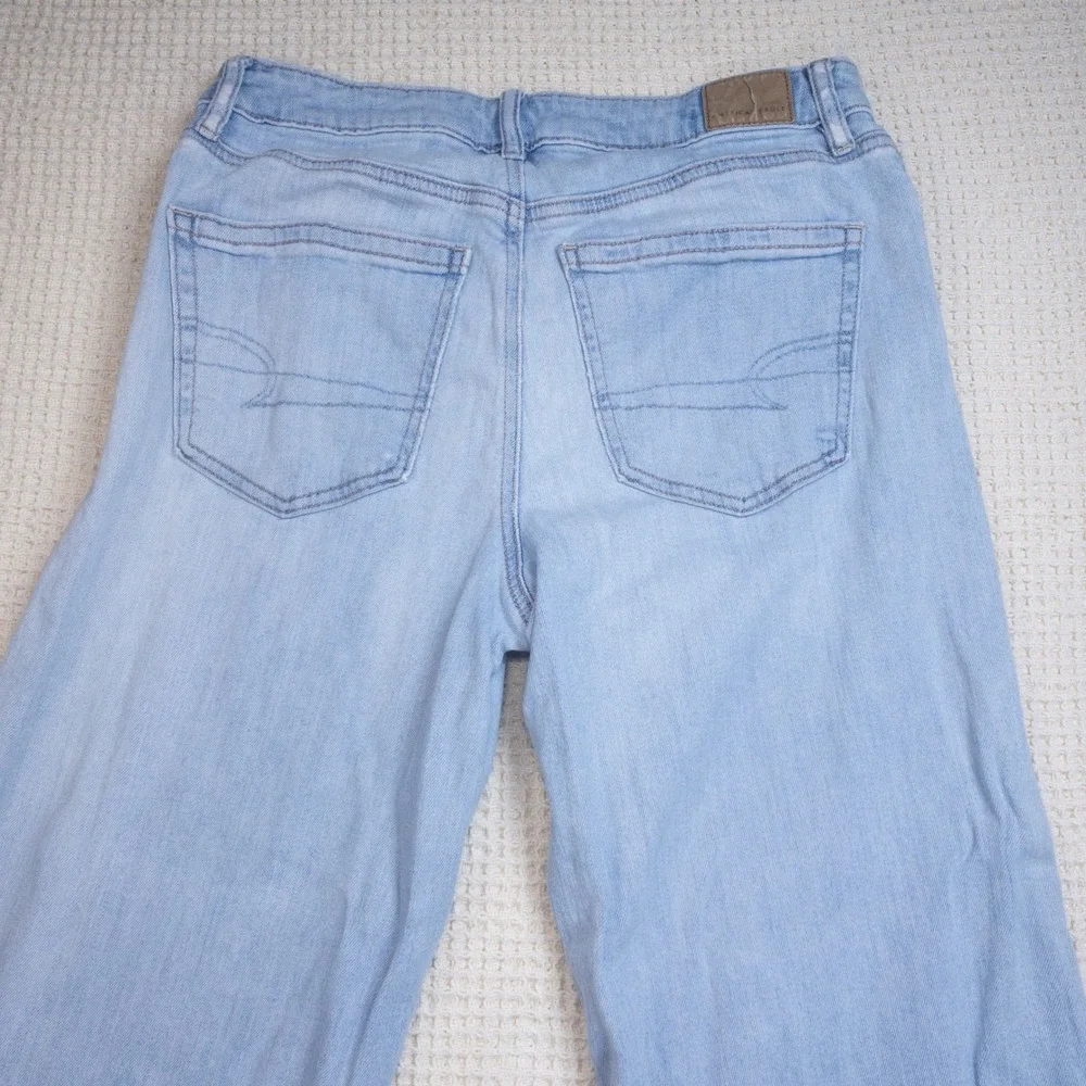 American Eagle Wide Leg High Rise Light Wash Raw Hem Jeans Women 2 Regular